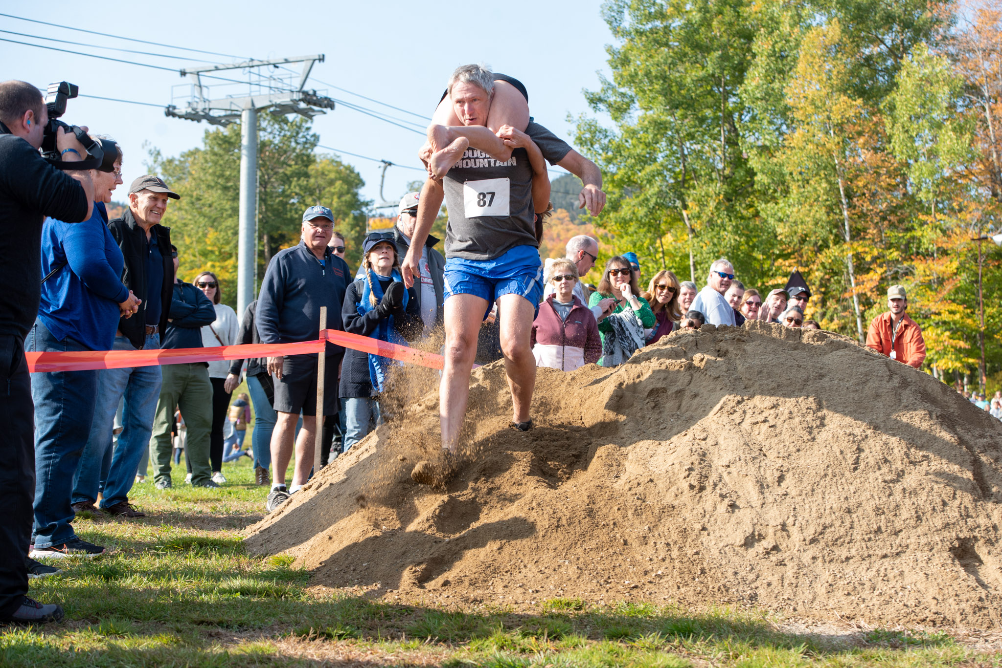 Team running over obstacle