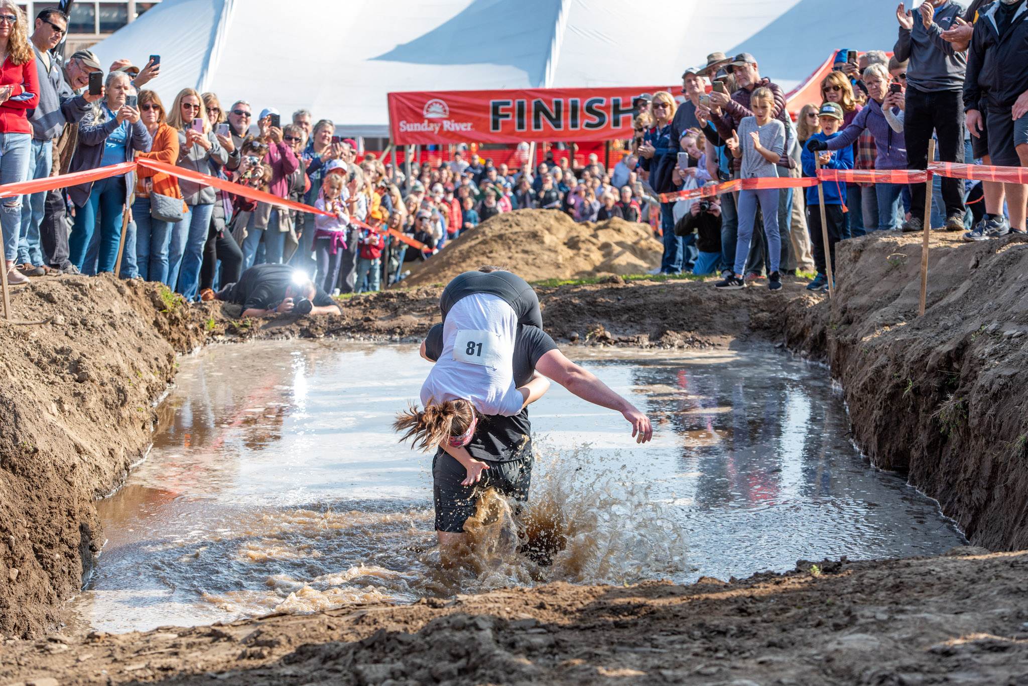 Team running through mud